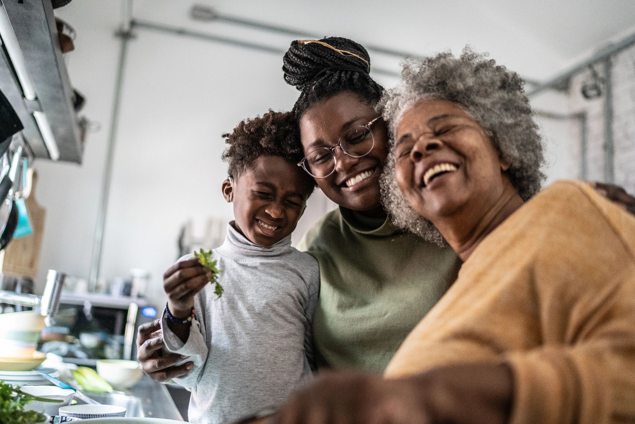 Family cooking together in a warm modern kitchen