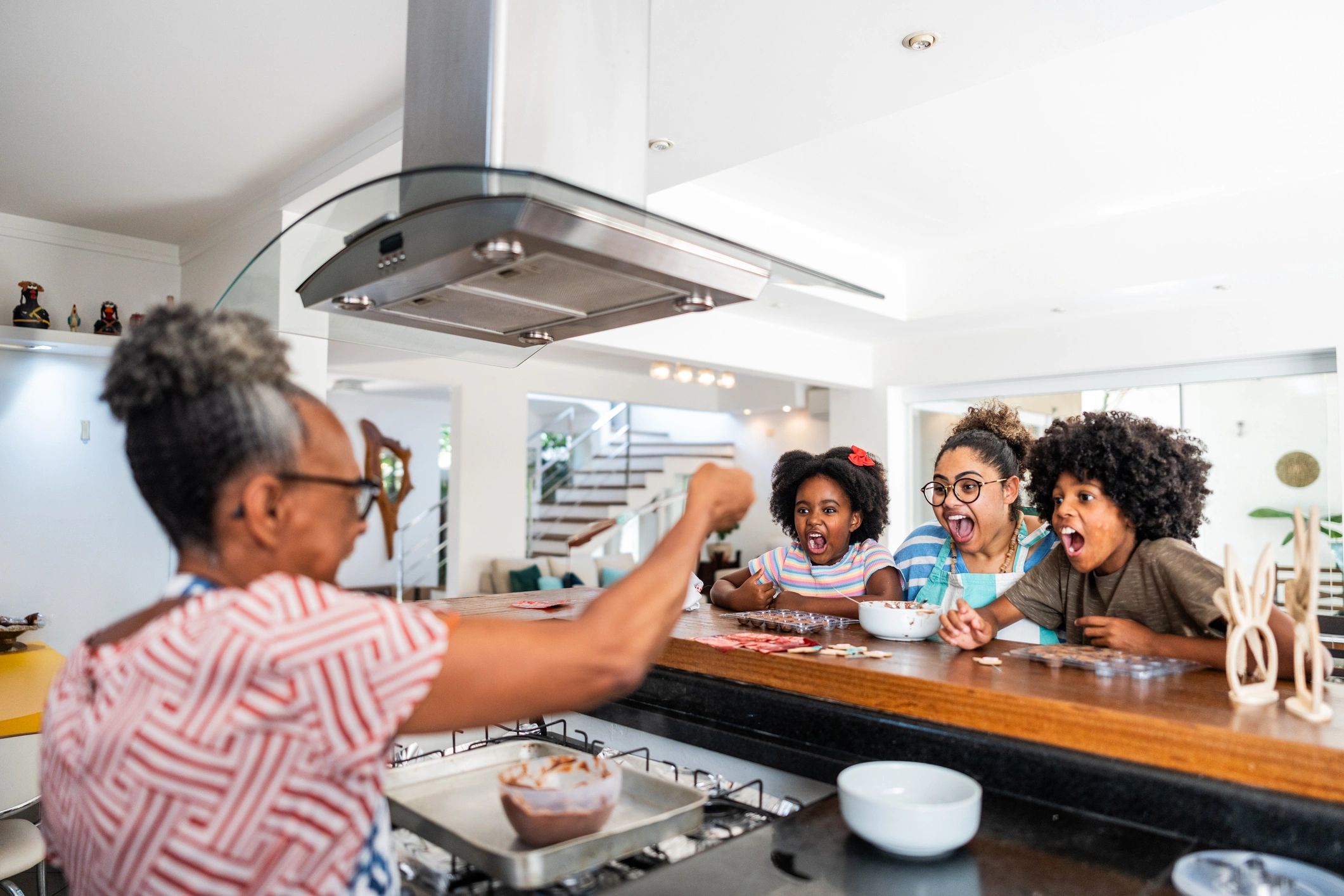 Family gathered at home around a kitchen table